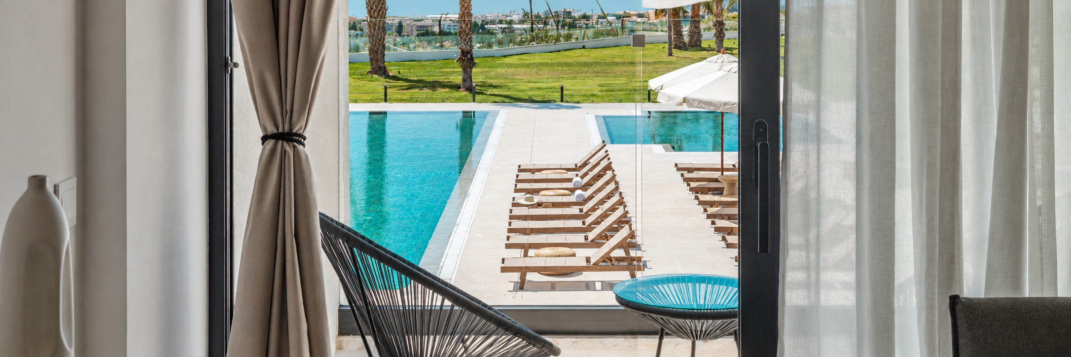 panoramic-hotel-interior-overlooking-turquoise-poo